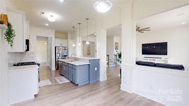 7651 Fenn Way, Fort Mill, SC 29707 - kitchen with a sink, appliances with stainless steel finishes, light countertops, white cabinetry, and open floor plan