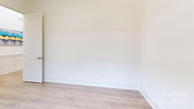 7651 Fenn Way, Fort Mill, SC 29707 - empty room featuring light wood-type flooring and a wainscoted wall