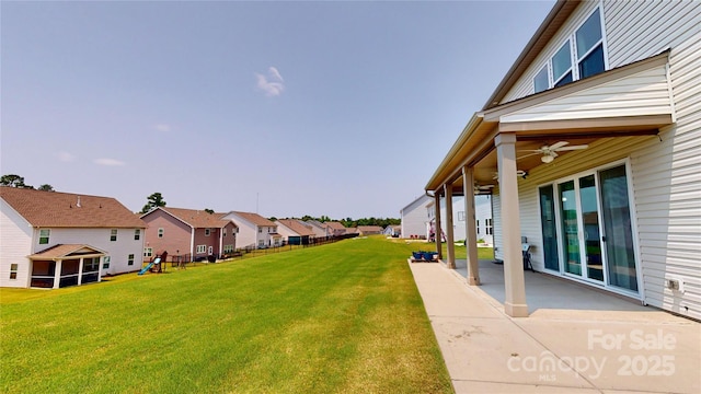 7651 Fenn Way, Fort Mill, SC 29707 - view of grassy yard featuring a ceiling fan, a residential view, a patio, and a playground