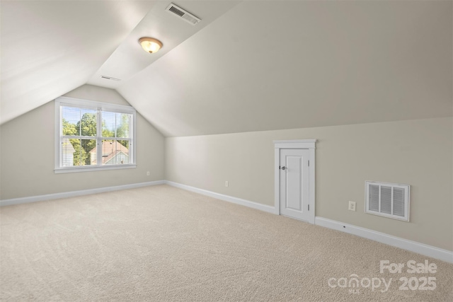 187 Water Oak Dr, Mooresville, NC 28117 - additional living space with carpet floors and vaulted ceiling