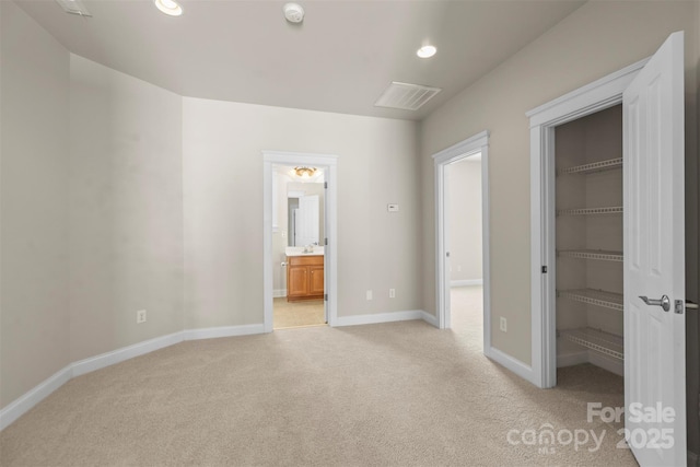 187 Water Oak Dr, Mooresville, NC 28117 - unfurnished bedroom featuring light colored carpet, a spacious closet, recessed lighting, a closet, and ensuite bath
