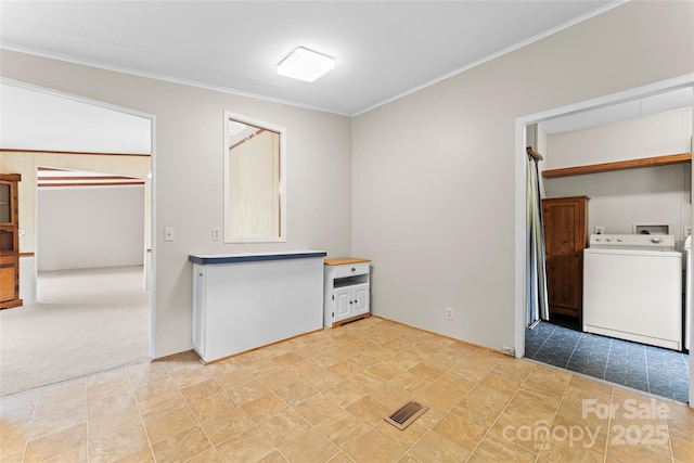 1773 Baldwin Ln, Lincolnton, NC 28092 - interior space with washer / clothes dryer, ornamental molding, and light colored carpet
