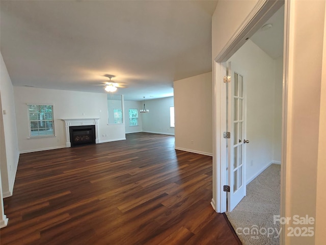 509 Settlers Grove Ln, Salisbury, NC 28146 - unfurnished living room featuring dark wood-type flooring, a ceiling fan, a fireplace, and french doors