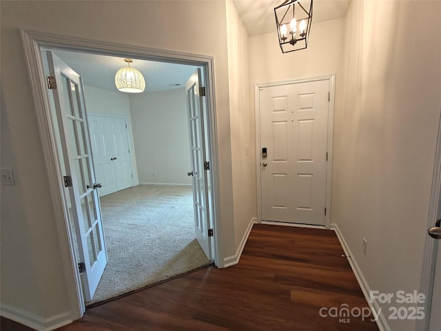 509 Settlers Grove Ln, Salisbury, NC 28146 - foyer entrance with a chandelier, dark wood-style floors, and french doors