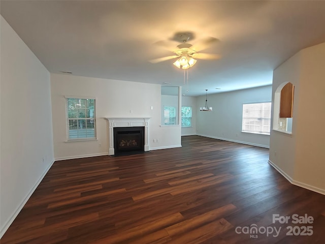 509 Settlers Grove Ln, Salisbury, NC 28146 - unfurnished living room with ceiling fan, dark wood finished floors, and a fireplace with flush hearth