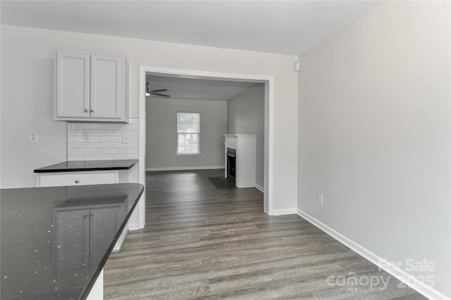 7806 Mcgarry Trl, Charlotte, NC 28214 - unfurnished living room featuring wood finished floors and a fireplace with flush hearth