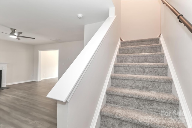 7806 Mcgarry Trl, Charlotte, NC 28214 - staircase with a ceiling fan and wood finished floors
