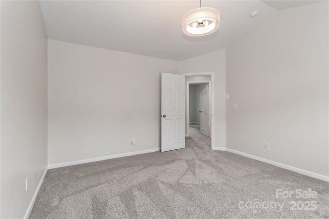 7806 Mcgarry Trl, Charlotte, NC 28214 - carpeted empty room with lofted ceiling and a smoke detector