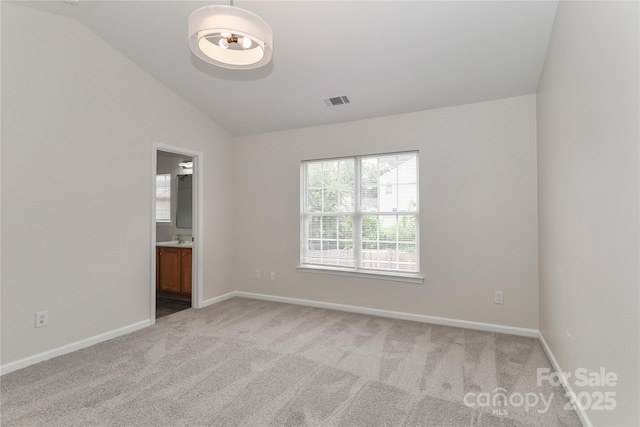 7806 Mcgarry Trl, Charlotte, NC 28214 - empty room featuring vaulted ceiling and light colored carpet