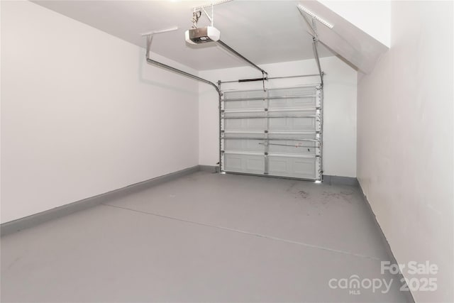 7806 Mcgarry Trl, Charlotte, NC 28214 - garage featuring a garage door opener and baseboards