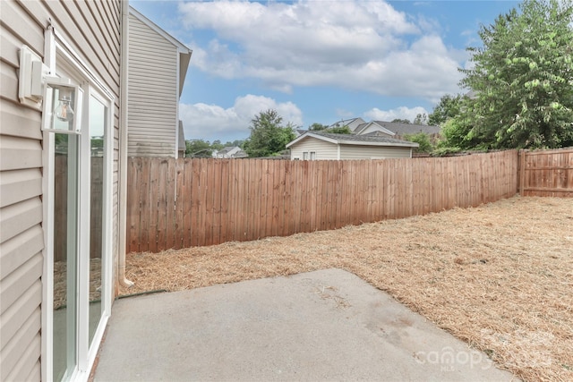 7806 Mcgarry Trl, Charlotte, NC 28214 - fenced backyard with a patio