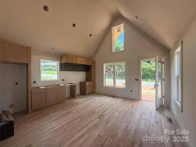 798 Country Club Dr, Waynesville, NC 28786 - unfurnished living room featuring high vaulted ceiling and light wood finished floors