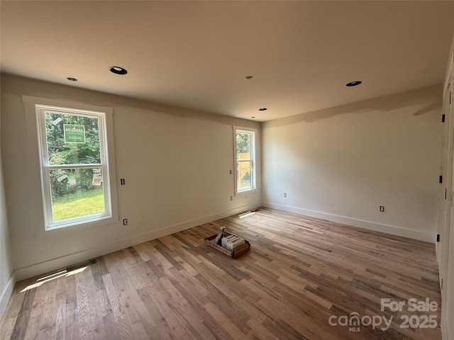 798 Country Club Dr, Waynesville, NC 28786 - empty room with plenty of natural light, light wood-style floors, and recessed lighting