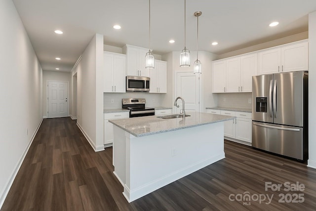 3833 Crossbane St, Kannapolis, NC 28081 - kitchen featuring stainless steel appliances, a sink, dark wood-type flooring, decorative backsplash, and recessed lighting
