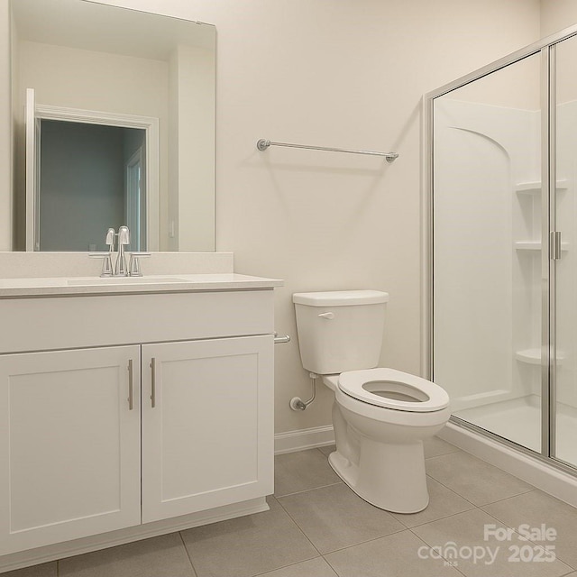 3833 Crossbane St, Kannapolis, NC 28081 - bathroom with tile patterned floors, vanity, a stall shower, toilet, and baseboards