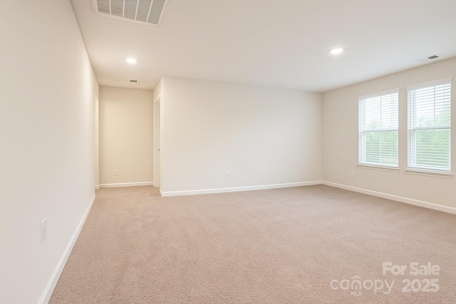 3833 Crossbane St, Kannapolis, NC 28081 - unfurnished room with light colored carpet, baseboards, and recessed lighting