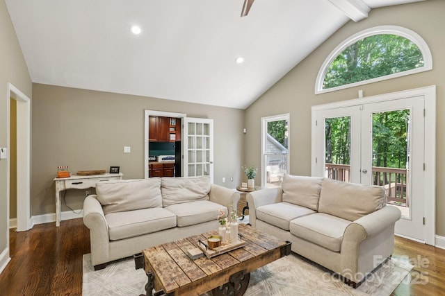10311 Windtree Ln, Charlotte, NC 28215 - living area featuring french doors, high vaulted ceiling, healthy amount of natural light, wood finished floors, and recessed lighting