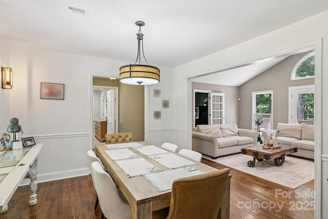 10311 Windtree Ln, Charlotte, NC 28215 - dining room with dark wood-type flooring and lofted ceiling
