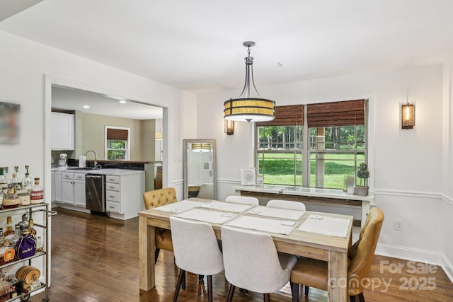 10311 Windtree Ln, Charlotte, NC 28215 - dining area with healthy amount of natural light and dark wood-style flooring