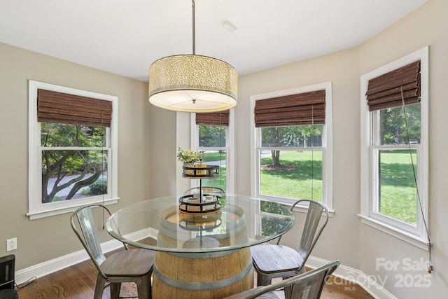 10311 Windtree Ln, Charlotte, NC 28215 - dining room featuring baseboards and dark wood finished floors
