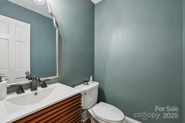 10311 Windtree Ln, Charlotte, NC 28215 - half bath with toilet, vanity, and baseboards