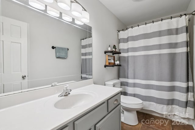 10311 Windtree Ln, Charlotte, NC 28215 - bathroom featuring toilet, vanity, tile patterned floors, and a shower with curtain