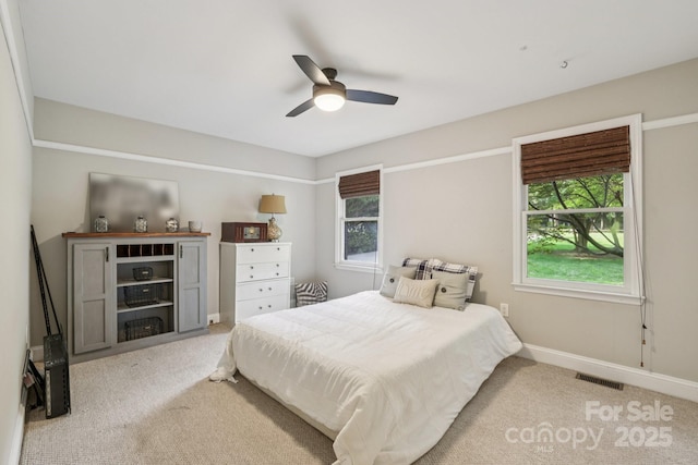 10311 Windtree Ln, Charlotte, NC 28215 - bedroom with light colored carpet, baseboards, and ceiling fan