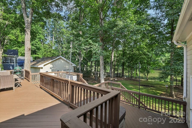 10311 Windtree Ln, Charlotte, NC 28215 - deck featuring view of scattered trees, a yard, and grilling area