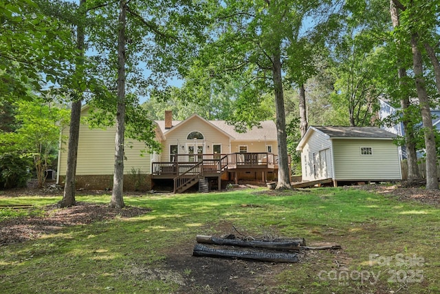 10311 Windtree Ln, Charlotte, NC 28215 - back of house featuring a wooden deck, an outdoor structure, a yard, a chimney, and stairs
