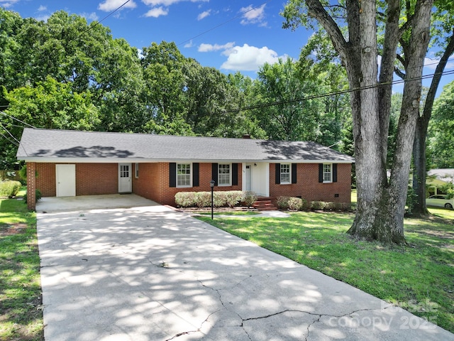 967 Hilldale Dr, Lancaster, SC 29720 - ranch-style home featuring concrete driveway, brick siding, a front yard, crawl space, and roof with shingles