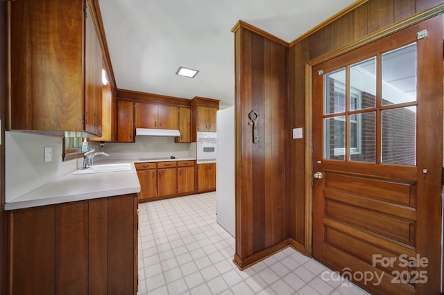 967 Hilldale Dr, Lancaster, SC 29720 - kitchen featuring a sink, light countertops, light tile patterned floors, brown cabinetry, and black electric cooktop