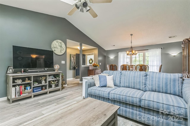 60 Southchase Dr, Fletcher, NC 28732 - living room with vaulted ceiling, light wood-style floors, a ceiling fan, a chandelier, and baseboards