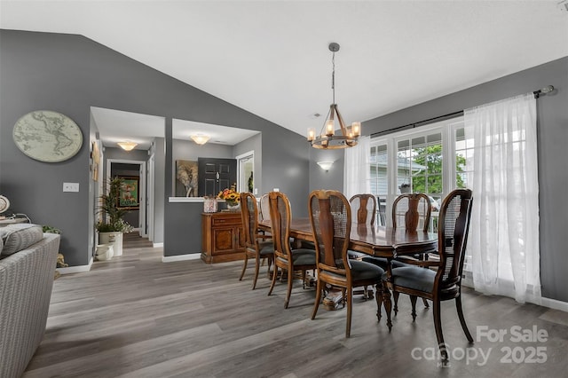60 Southchase Dr, Fletcher, NC 28732 - dining room with wood finished floors, a chandelier, baseboards, and vaulted ceiling