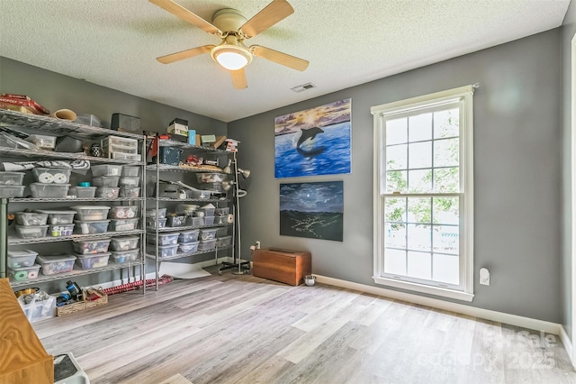 60 Southchase Dr, Fletcher, NC 28732 - living area with wood finished floors, a textured ceiling, a ceiling fan, and baseboards