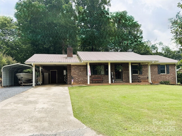 136 Christopher Rd, Marion, NC 28752 - single story home featuring driveway, a front lawn, a chimney, a metal roof, and brick siding