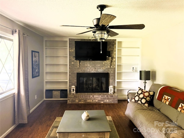 136 Christopher Rd, Marion, NC 28752 - living room with built in shelves, plenty of natural light, wood finished floors, a ceiling fan, and a textured ceiling