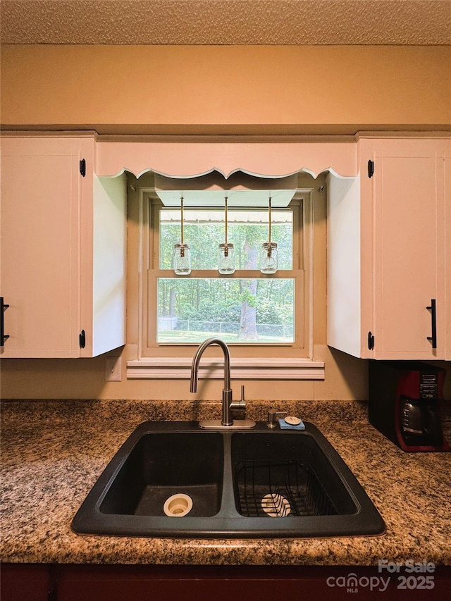 136 Christopher Rd, Marion, NC 28752 - kitchen with white cabinetry and dark countertops