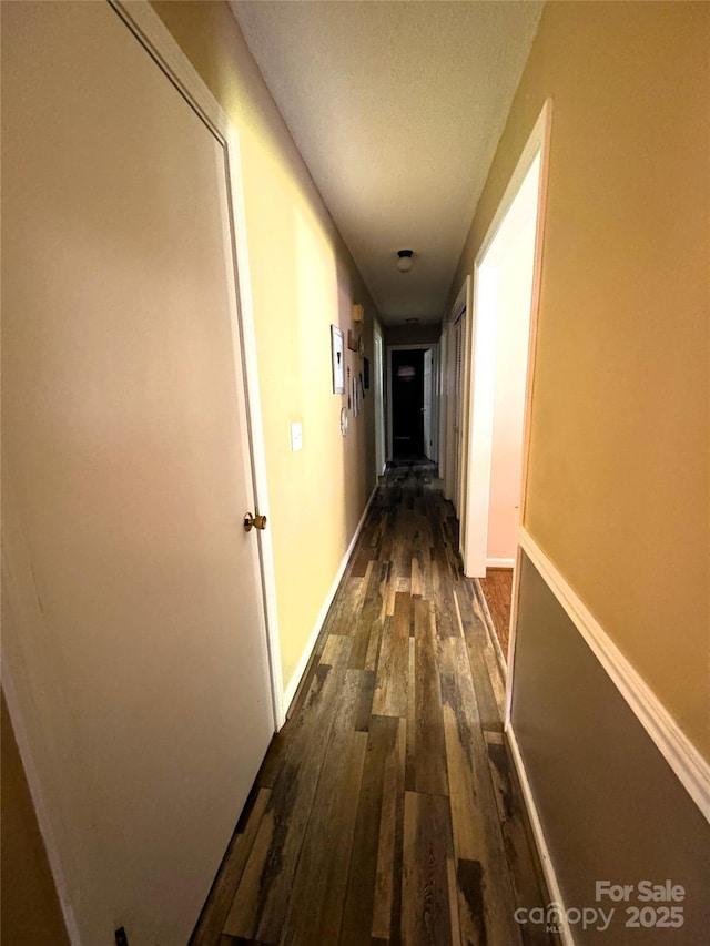 136 Christopher Rd, Marion, NC 28752 - hallway featuring dark wood-style floors and a textured ceiling