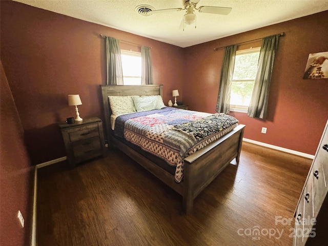 136 Christopher Rd, Marion, NC 28752 - bedroom featuring wood finished floors, ceiling fan, and a textured ceiling