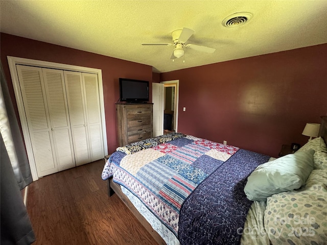 136 Christopher Rd, Marion, NC 28752 - bedroom with wood finished floors, a closet, a ceiling fan, and a textured ceiling