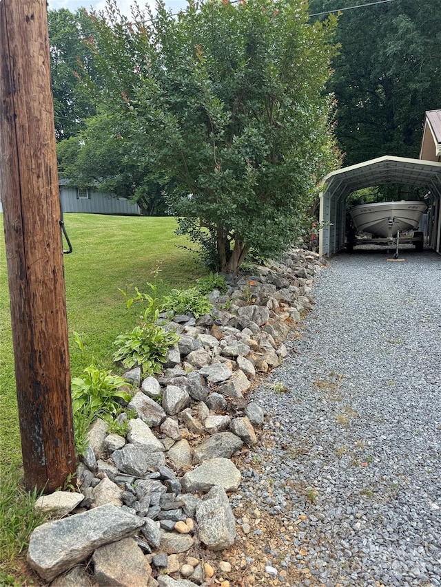 136 Christopher Rd, Marion, NC 28752 - view of grassy yard featuring a carport and driveway