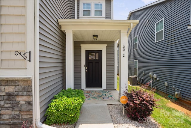 10012 Michael Crossing Dr, Charlotte, NC 28213 - property entrance with cooling unit and a porch