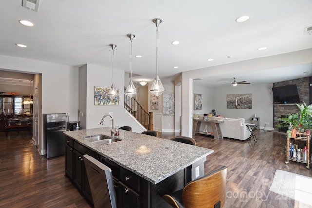 10012 Michael Crossing Dr, Charlotte, NC 28213 - kitchen featuring a sink, dishwasher, ceiling fan, dark wood-style flooring, and recessed lighting