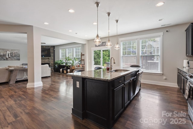 10012 Michael Crossing Dr, Charlotte, NC 28213 - kitchen with a sink, open floor plan, a fireplace, plenty of natural light, and recessed lighting