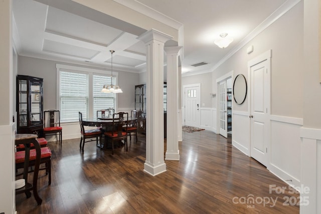 10012 Michael Crossing Dr, Charlotte, NC 28213 - dining area featuring ornate columns, a decorative wall, plenty of natural light, crown molding, and dark wood-style floors