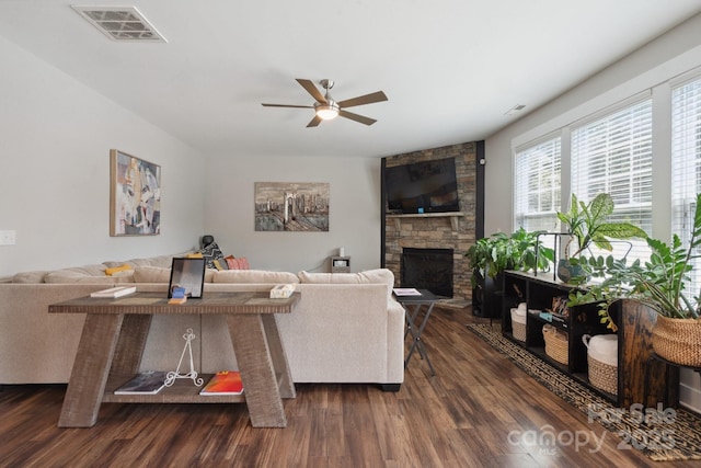 10012 Michael Crossing Dr, Charlotte, NC 28213 - living room featuring a ceiling fan, dark wood-style floors, and a stone fireplace