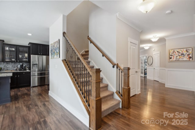 10012 Michael Crossing Dr, Charlotte, NC 28213 - staircase with wood finished floors, crown molding, and recessed lighting