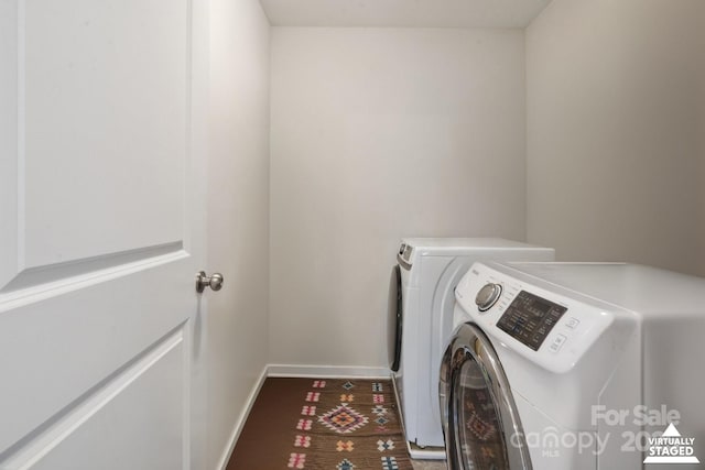 10012 Michael Crossing Dr, Charlotte, NC 28213 - laundry room with washer and dryer and baseboards