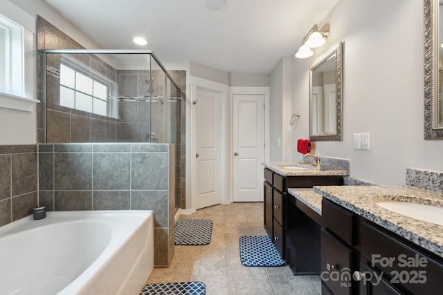 10012 Michael Crossing Dr, Charlotte, NC 28213 - bathroom featuring two vanities, a shower stall, a bath, and tile patterned floors