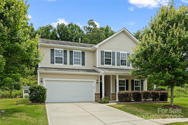 8400 Empress Ct, Charlotte, NC 28227 - traditional-style house featuring driveway, an attached garage, a front lawn, and covered porch